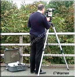 Fully Portable Laser kit, this one over the M6, tracking the outside lane traffic (oncoming) and taking a picture of all speeders doing over 85mph, note the support case on the floor, this has houses the printer and video recorder  Copyright © Steve Warren.  